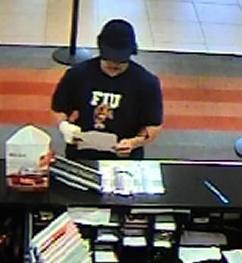 The FBI is releasing photographs from a bank robbery that took place today, September 25, at approximately 9:37 a.