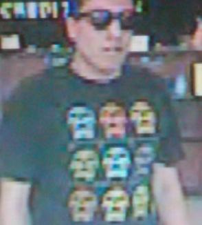 Law enforcement is seeking bank robber who likes to wear dark sunglasses and T-shirts, and used his smartphone as a demand note to rob banks in San Diego.