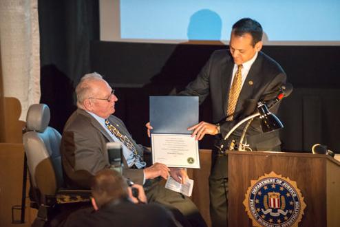SAC William P. Woods, FBI St. Louis, presented the 2014 Director's Community Leadership Award to Wehrenberg Theatres for its commitment to protecting children.