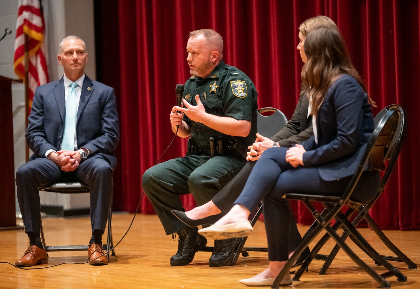 ASAC Markovsky, Lt. West Kennedy, of St. Johns County Sheriff Youth Services Unit, and two female FBI SAs answer questions from audience at a Be Smart With Your Kids' Smartphone event at Creekside High School in February, 2024.