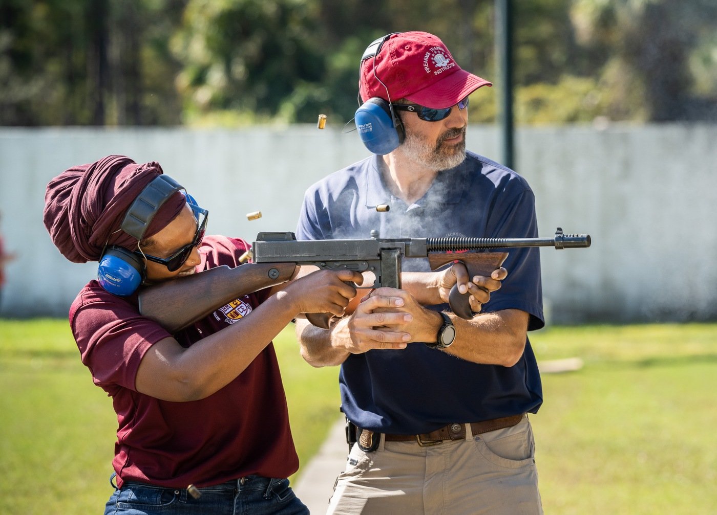 FBI Jacksonville’s Principal Firearms Instructor assisting a community leader shoot a historic Thompson Model 1928 (Tommy Gun).