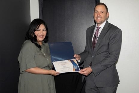 April 11, 2024 – Cristy Lopez (L) is presented with the 2023 Director’s Community Leadership Award by 
FBI Dallas SAC Chad Yarbrough (R). 