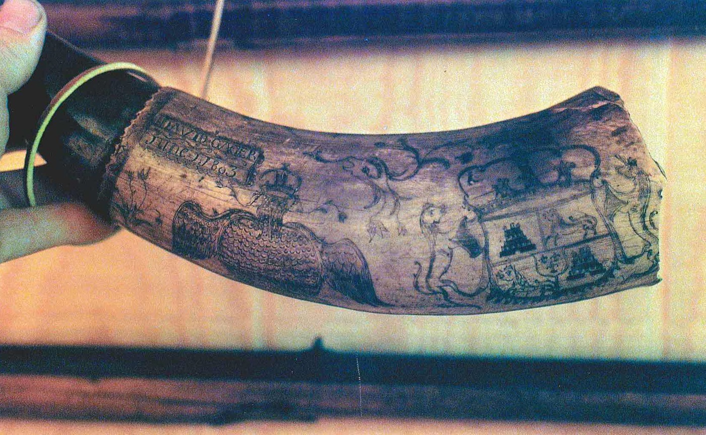The item belonged to David Gager, a Connecticut Revolutionary War soldier who later became a pioneer in Wayne County’s Lebanon Township.  
He carried the powder horn—a container used to carry gunpowder—with him during the War of 1812.  
This item was stolen from the Wayne County Historical Society in Honesdale, Pennsylvania, sometime before December 7, 1994.  
It may have been sold at auction afterwards. 
The powder horn is 8 inches long and has no bottom.  
The item is inscribed with the words “David Gager,” a date of June 1803, and detailed drawings of an eagle, a crest flanked by animals, and flower designs.  
This photo is courtesy of the Department of Justice.