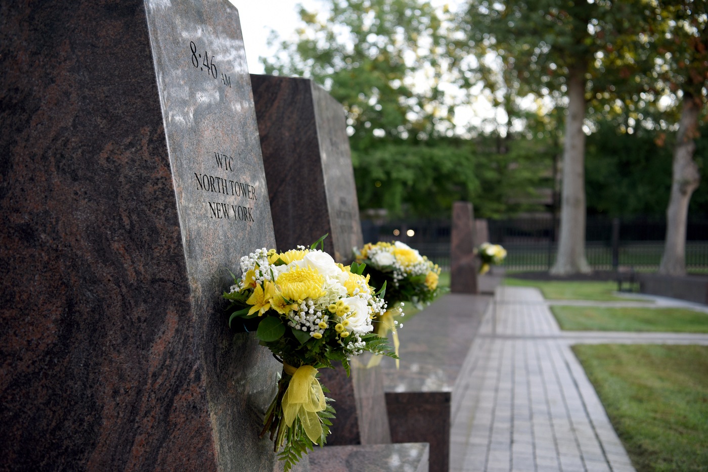 Flowers rest against the 9/11 memorial at the Terrorist Screening Center during a remembrance ceremony on September 10, 2021, marking the 20th anniversary of the terrorist attacks.