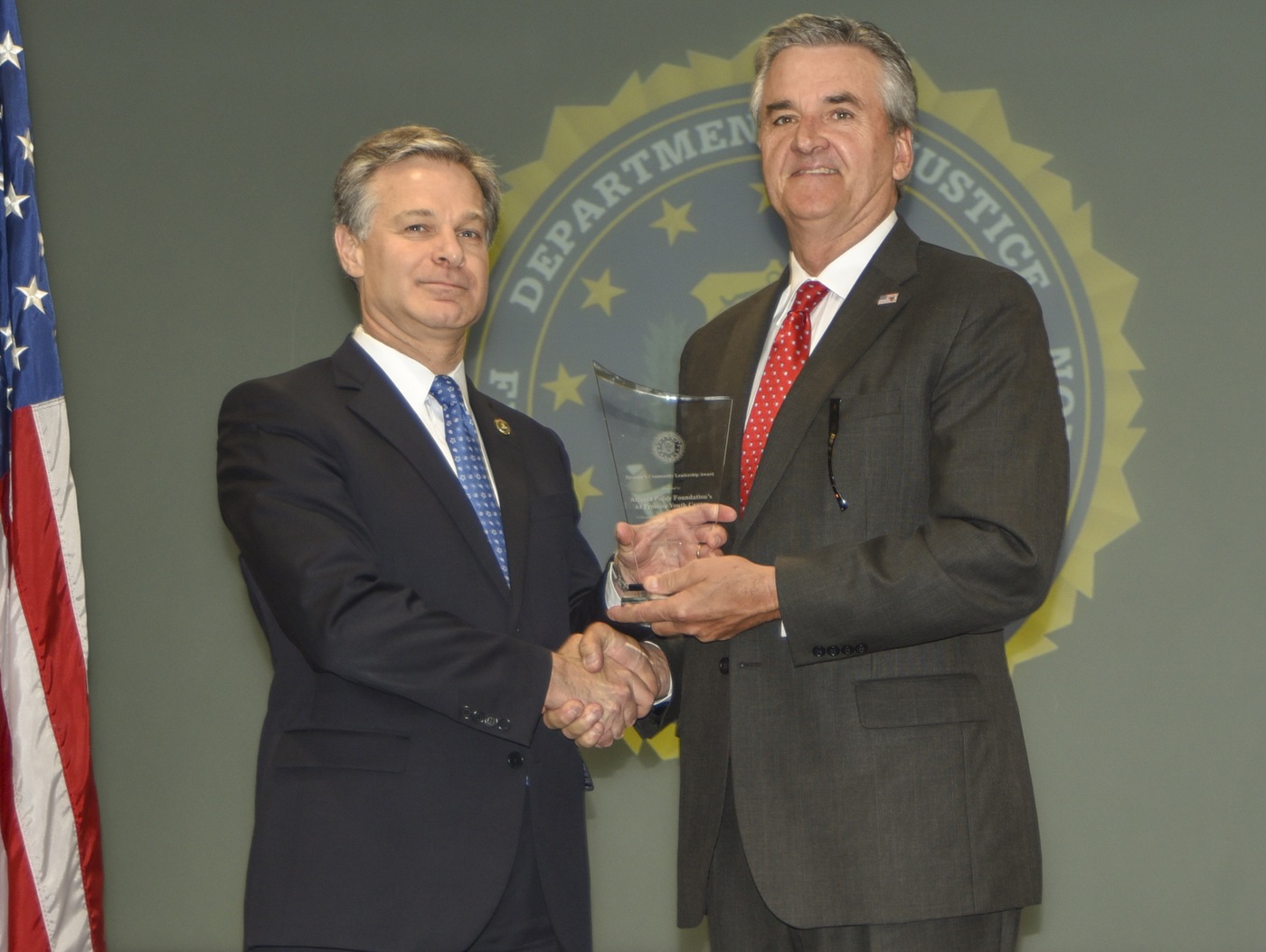 FBI Director Christopher Wray presents Atlanta Division recipient the Atlanta Police Foundation’s At Promise Youth Center with the Director’s Community Leadership Award (DCLA) at a ceremony at FBI Headquarters on May 3, 2019.