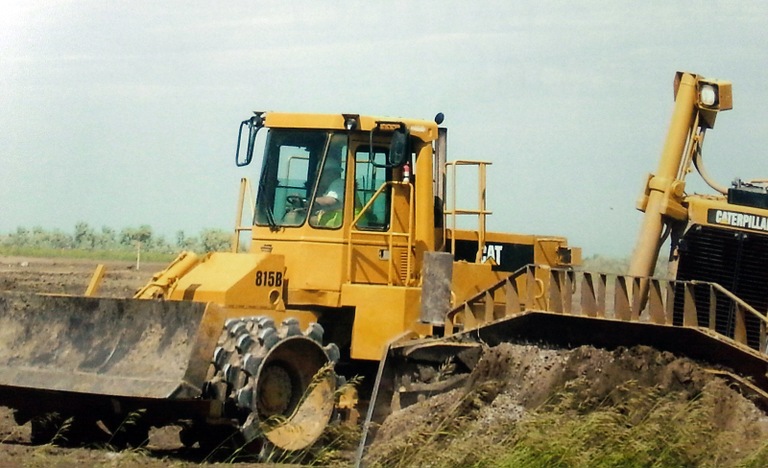 Photo of a tractor clearing a field. Ronald Johnson showed this photo to investors in his Bakken housing project to trick them into thinking their money was being used for its intended purpose.