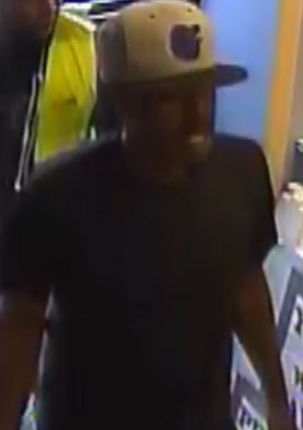 One of two individuals who committed an armed robbery of Clyde’s Sport Shop at 2307 Hammonds Ferry Road in Baltimore, Maryland on April 6, 2016.