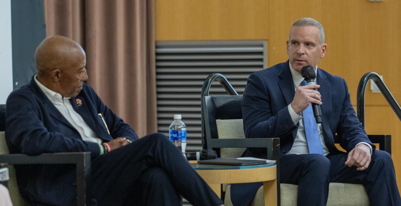 Paul Abbate, right, deputy director of the FBI, and Kevin Liles, chairman and CEO of 300 Elektra Entertainment, are seen during a panel called "Building Bridges with the African American Community" at the 2023 Beacon Conference.
