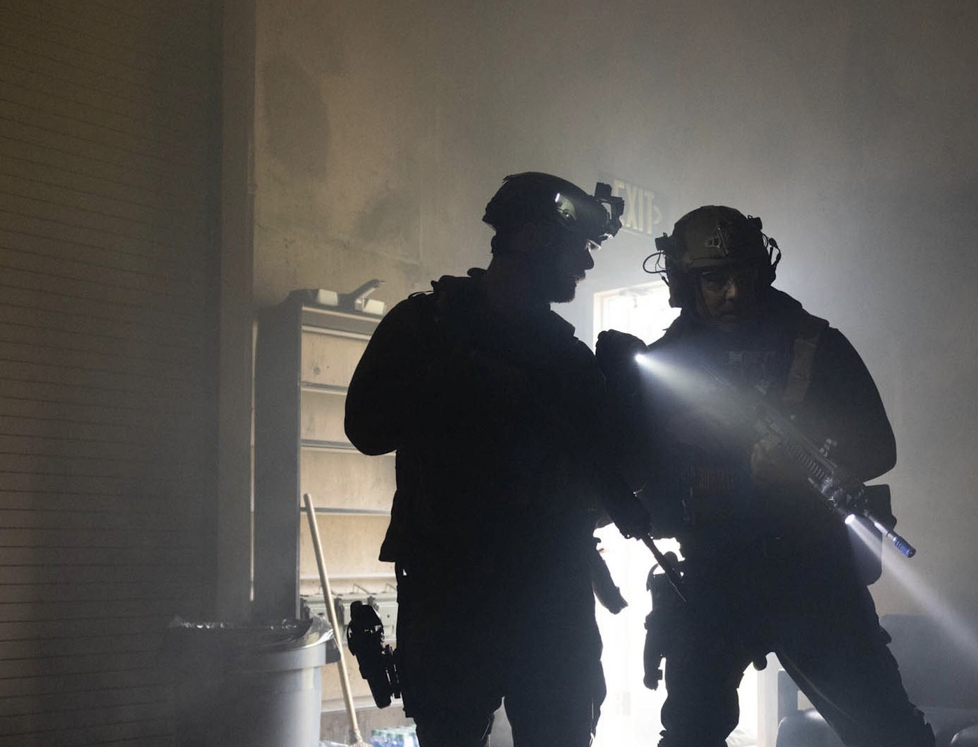 Public safety bomb technicians continue their threat assessment during a training exercise.
