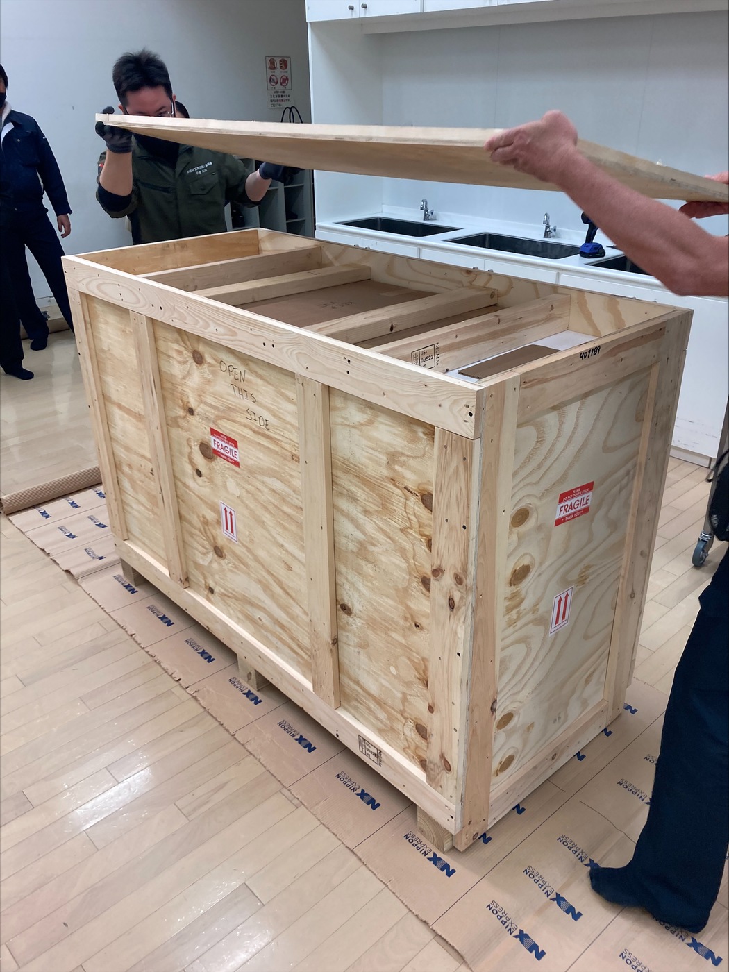 This photo shows artifacts being crated in preparation for transfer back to Okinawa Prefecture, Japan, in March 2024.