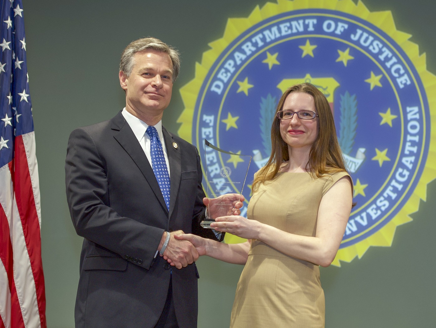 FBI Director Christopher Wray presents Buffalo Division recipient Emma Buckthal with the Director’s Community Leadership Award (DCLA) at a ceremony at FBI Headquarters on May 3, 2019.