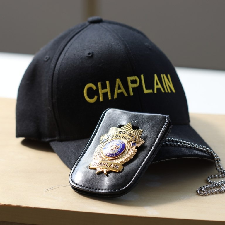 Chaplain hat and badge. Photo by Detective Paul Olsen, Sheboygan, Wisconsin, Police Department.