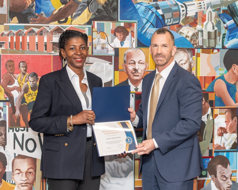 FBI Charlotte Special Agent in Charge Robert M. DeWitt recently presented a certificate for the Director’s Community Leadership Award (DCLA) to Jennifer Joyner, director of the Center for Career and Postgraduate Readiness, during a ceremony at Johnson C. Smith University.