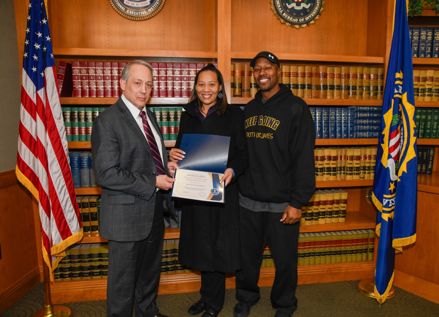Photo caption – FBI Cleveland Special Agent in Charge Greg Nelsen presents Tamia and Timothy Woods with the Directors Community Leadership Award
