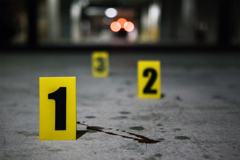 Stock image depicting a crime scene with evidence markers