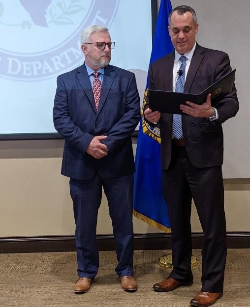 FBI Special Agent in Charge Matthew DeSarno presents FBI Director’s Certificates to Lubbock Police Department Detective and FBI Task Force Officer John Bentley