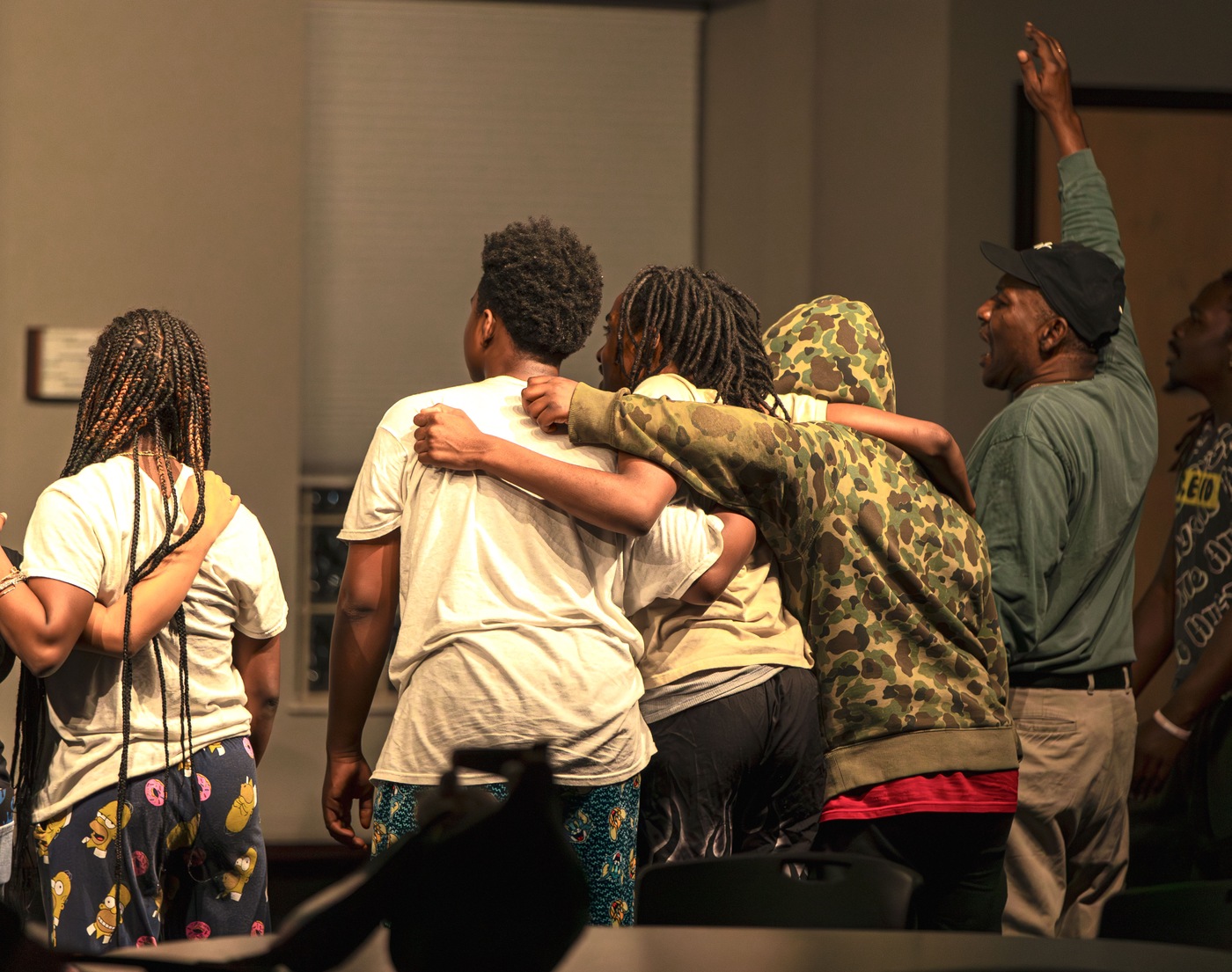 Congregants cheer after learning their pastor, Thaddeus Black, of Tulakes Community Church in Bethany, Oklahoma, received FBI Oklahoma City's 2023 Director's Community Leadership Award. 