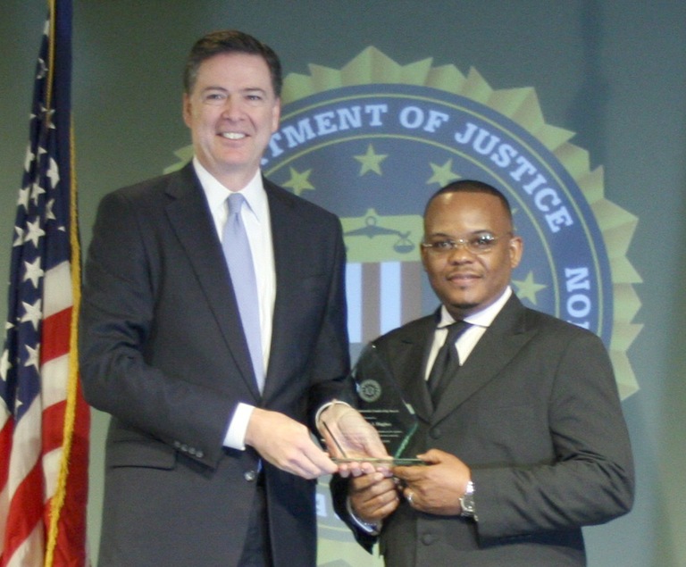 Dr. Derrick J. Hughes Receives Director’s Community Leadership Award from Director Comey on April 15, 2016