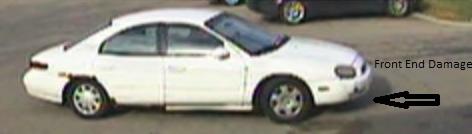 Vehicle used by the suspect in the robbery of the TCF Bank branch located at 17535 12 Mile Road in Lathrup Village, Michigan on October 6, 2014. The suspect fled the scene in an older model, white Ford Taurus or Mercury Sable that had front-end damage, a dark driver-side mirror, and a white passenger-side mirror.