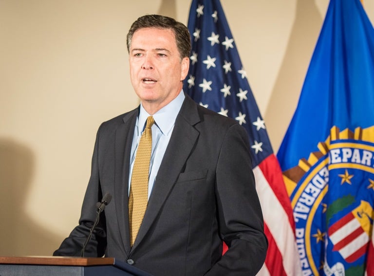 Director Comey addresses reporters during a July 5, 2016 press briefing at FBI Headquarters on the investigation of Secretary Hillary Clinton’s use of a personal e-mail system.