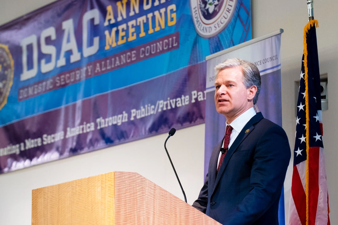 Director Christopher Wray addresses the 2022 DSAC annual meeting.
