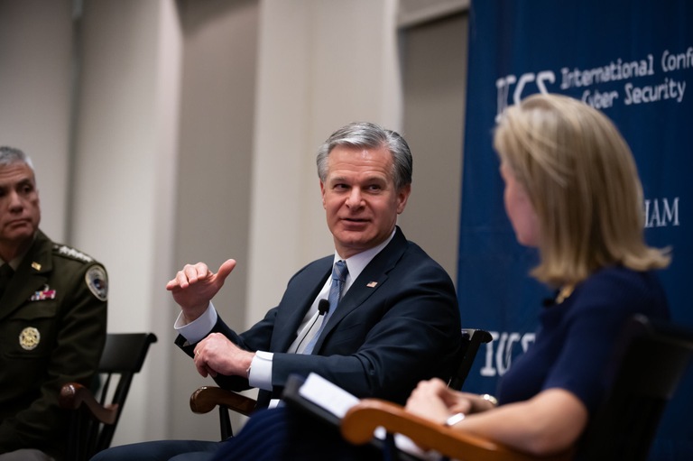 FBI Director Christopher Wray (center) takes part in a fireside chat with U.S. Army Gen. Paul M. Nakasoneathe dual-hatted National Security Agency director and U.S. Cyber Command commanderathat was moderated by National Public Radio journalist Mary Louise Kelly (right) at Fordham University's Lincoln Center campus as part of the 2024 Fordham International Conference on Cybersecurity in New York City on January 9, 2024.