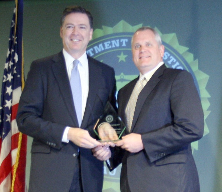 Chris Newlin Receives Director’s Community Leadership Award from Director Comey on April 15, 2016
