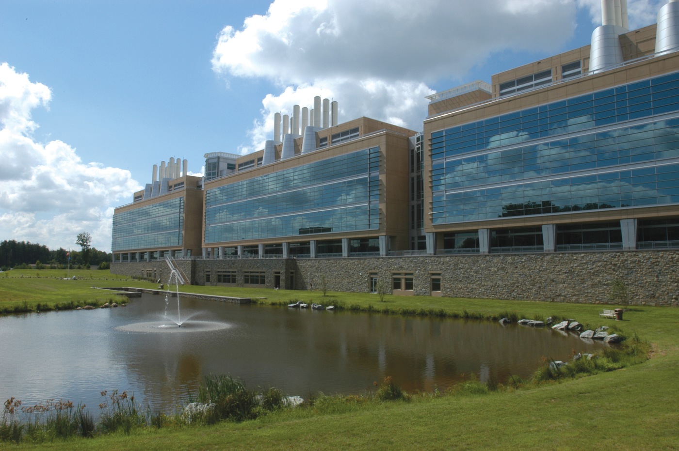 FBI Laboratory building in the summer, with a fountain pool in front, at Quantico, Virginia.