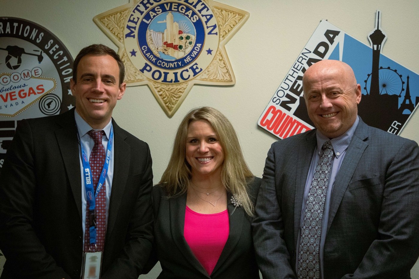 Section Lieutenant, Southern Nevada Counterterrorism Center Adam Seely, Supervisory Special Agent Mari Panovich, and Executive Director, Southern Nevada Counterterrorism Center Cary Underwood pose for a photo at the Las Vegas Fusion Center.