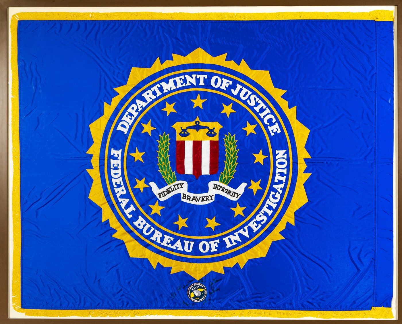 The only FBI flag flown in space celebrates its 25th anniversary. The flag hangs in the Director’s corridor in HQ. It flew aboard the Space Shuttle Discovery, STS-82, in February 1997. The flag measures 53" long by 66" wide.
