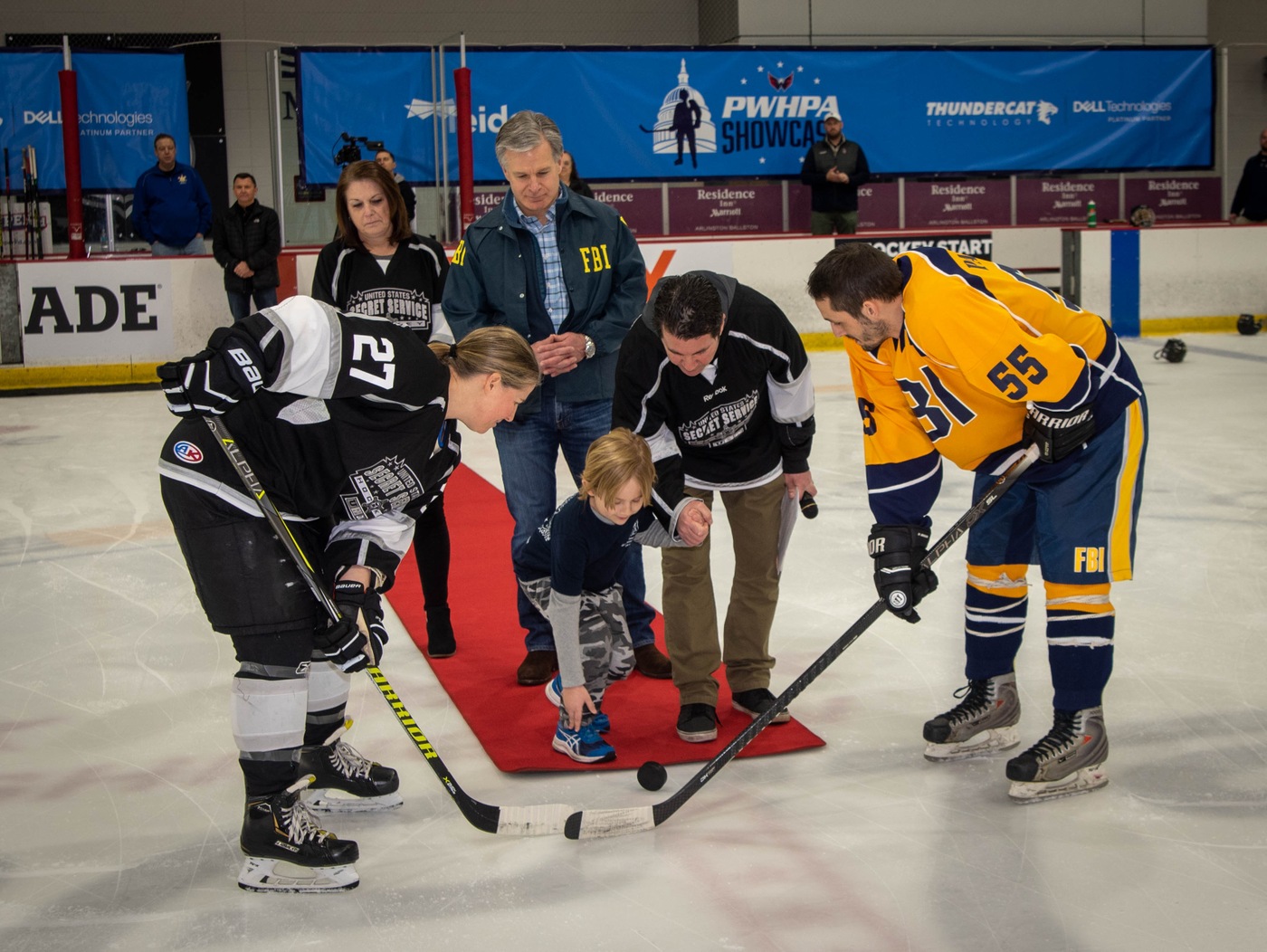 Ceremonial puck drop with Eli Alfin, Director Wray, USSS Director Cheatle, and Elliot Segal