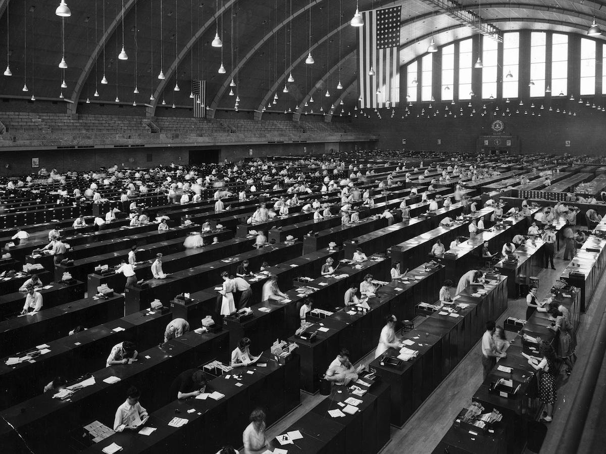 FBI fingerprint files and examiners at the D.C. National Guard armory at 2001 East Capitol Street SE during World War II.