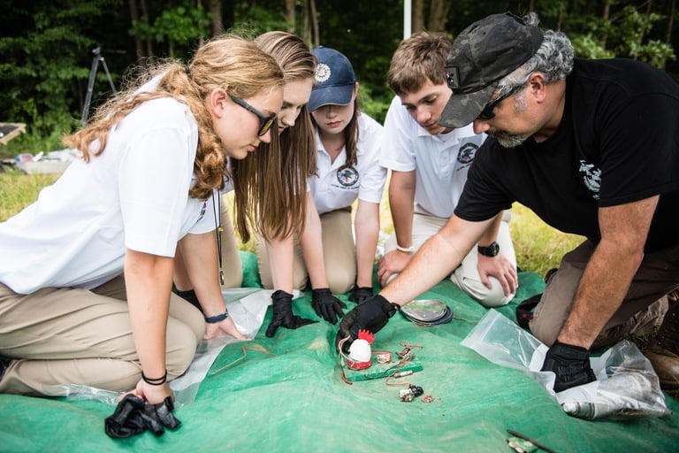 High school students study evidence collected from a simulated explosive device during a weeklong Future Agents in Training (FAIT) program sponsored by the FBI's Washington Field Office.
