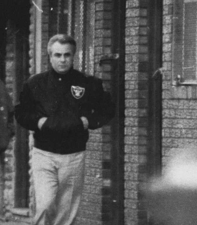 Surveillance photo of mobster John Gotti, walking down a street in 1980s in New York City.