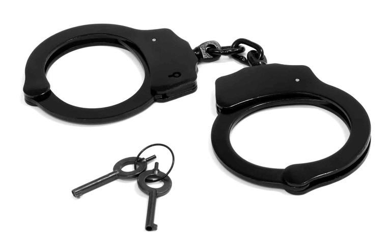 Stock image of a pair of handcuffs and keys. (From CJIS Link article)