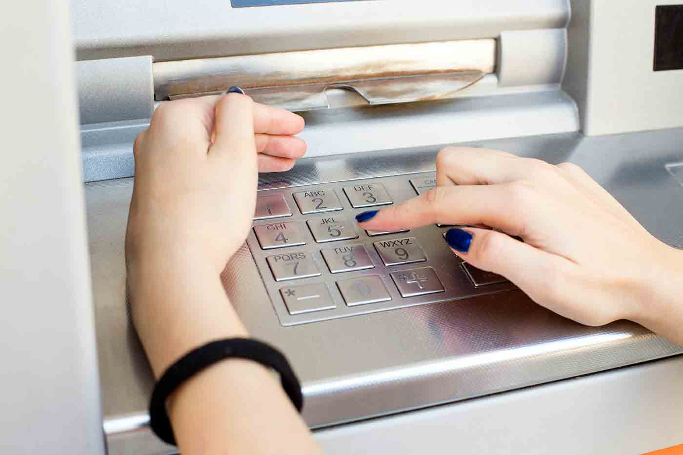Hands on ATM Keypad (Stock Image)