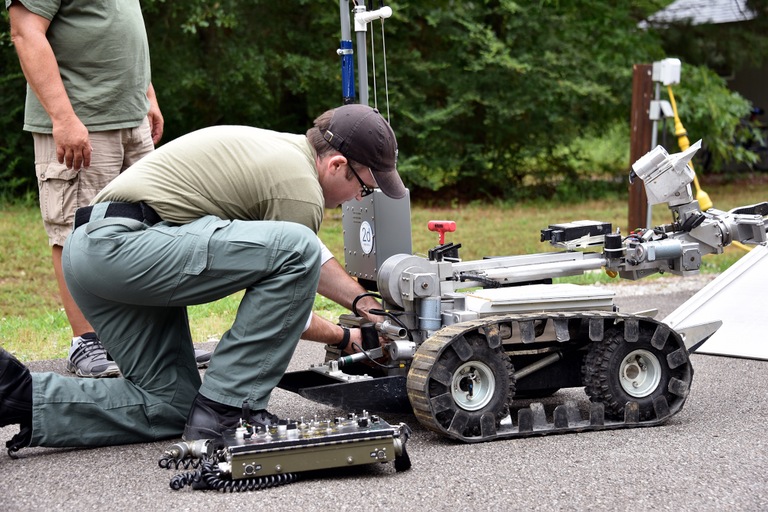 A bomb technician prepares a robot to search for a simulated explosive at the FBI’s Hazardous Devices School at Redstone Arsenal in Huntsville, Alabama.