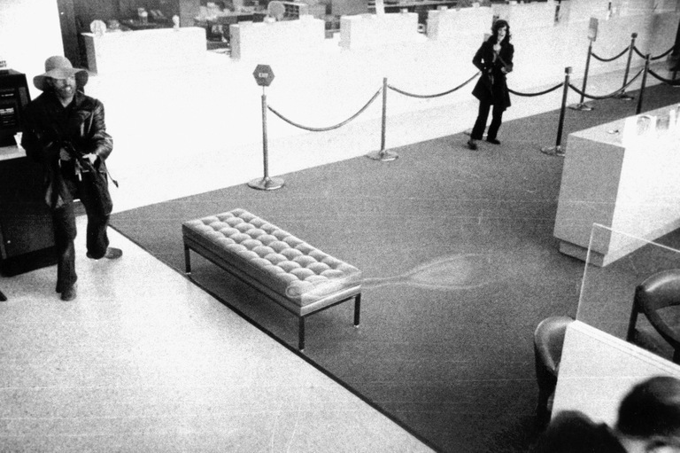 Patty Hearst Holding Rifle and Robbing Bank with Donald DeFreeze in April 1974 Patty Hearst Holding Rifle and Robbing Bank with Donald DeFreeze in April 1974