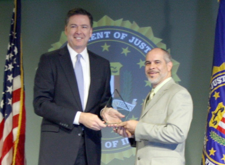 Hector M. Perez Receives Director’s Community Leadership Award from Director Comey on April 15, 2016