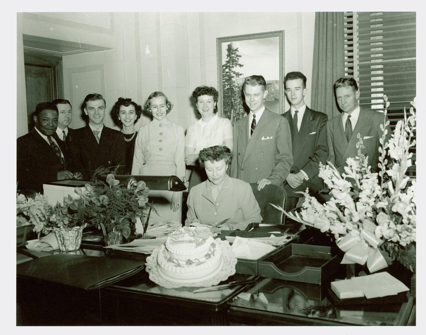 1950s-era photo photo depicting J. Edgar Hoover's assistant, Helen Gandy, celebrating with colleagues.