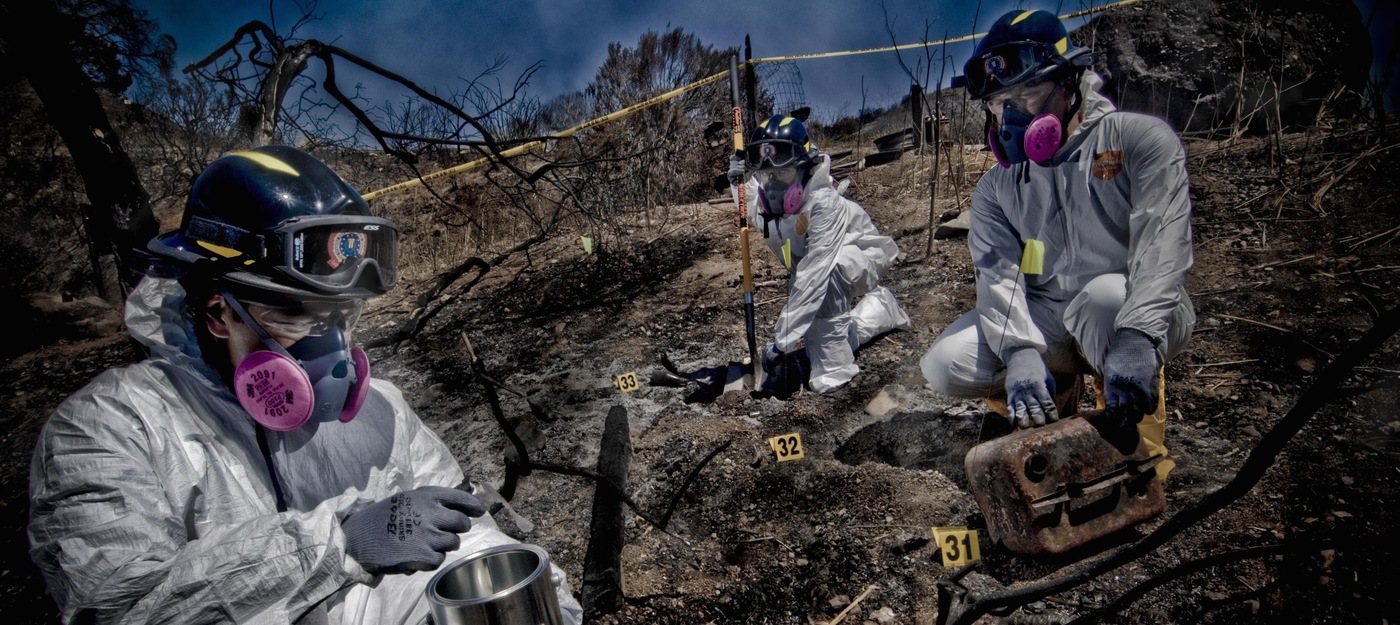 Evidence Response Team members working at a site on a hillside in July 2009.
