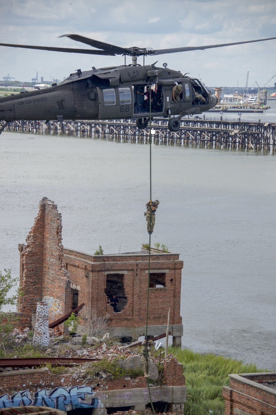 Photo of FBI agents climbing down a rope suspended by a Black Hawk helicopter during a Hostage Rescue Team (HRT) training exercise held August 5-7, 2019, in Charleston, South Carolina.