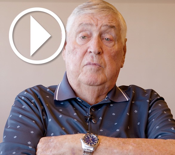 Jim Huggins With Play Icon