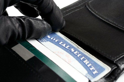 Hand on Social Security Card