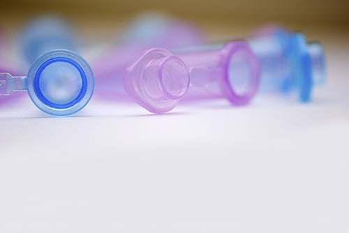 Pink and Blue Tubes in Laboratory Setting (Stock image)