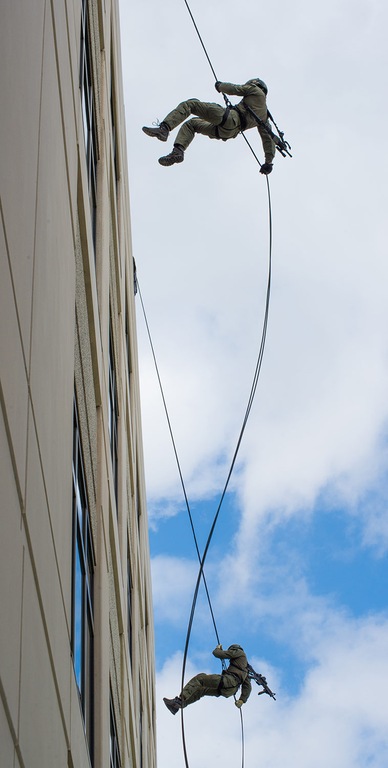 FBI Jacksonville SWAT team operators rappel from the field office building before the start of the first annual FBI Appreciation Network luncheon.