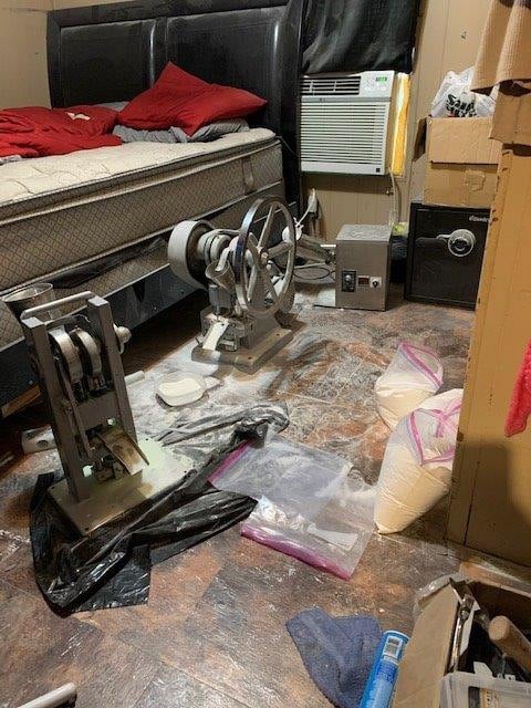 Pill press, grinder and bags of pill binder material found during JCODE operation in Louisiana.