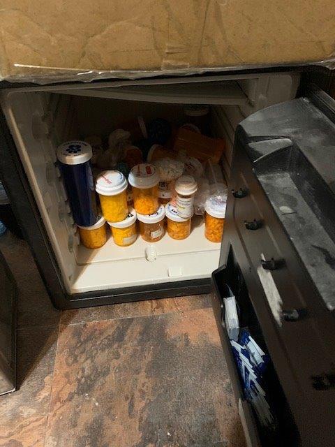 Safe containing various bottles and bags of Xanax, Oxycodone, Hydrocodone, Adderall and Vyvanse