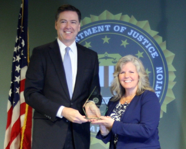 Julie Kenniston Receives Director’s Community Leadership Award from Director Comey on April 15, 2016