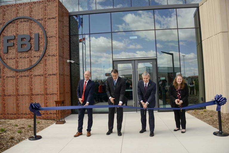 (From left to right) David Rumsey, acting regional commissioner for the  General Services Administration; Stephen Cyrus, special agent in charge of the FBI Kansas City Field Office; FBI Director Christopher Wray; and Ruth Noah, granddaughter of former Kansas City Police Chief and FBI Director Clarence Kelley cut the ribbon on the new FBI Kansas City Field Office headquarters building in Kansas City, Missouri, on April 3, 2024.